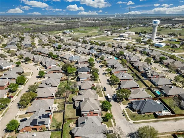an aerial view of residential building and lake