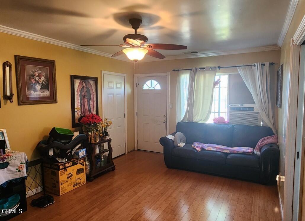 214 Smith Street Oxnard, CA 93033 - Photo 5 of 8 a living room with furniture and a large window