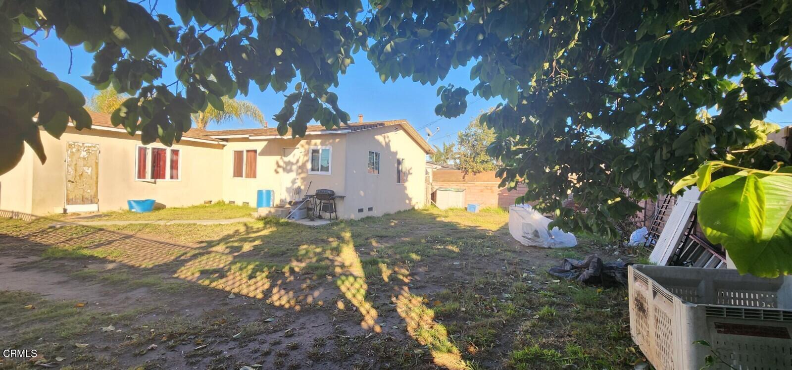 214 Smith Street Oxnard, CA 93033 - Photo 6 of 8 a view of a house with a yard
