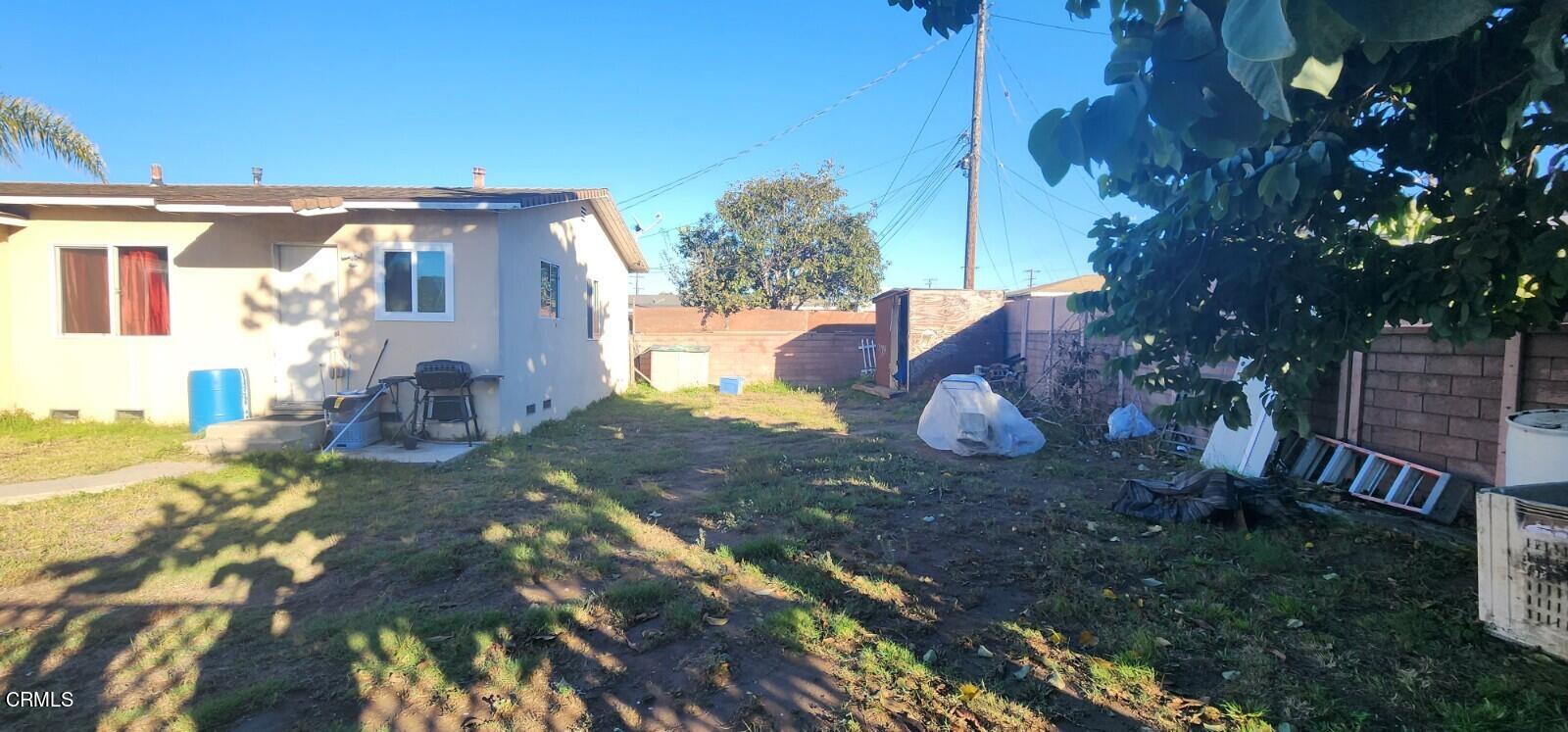 214 Smith Street Oxnard, CA 93033 - Photo 7 of 8 a view of a house with a yard