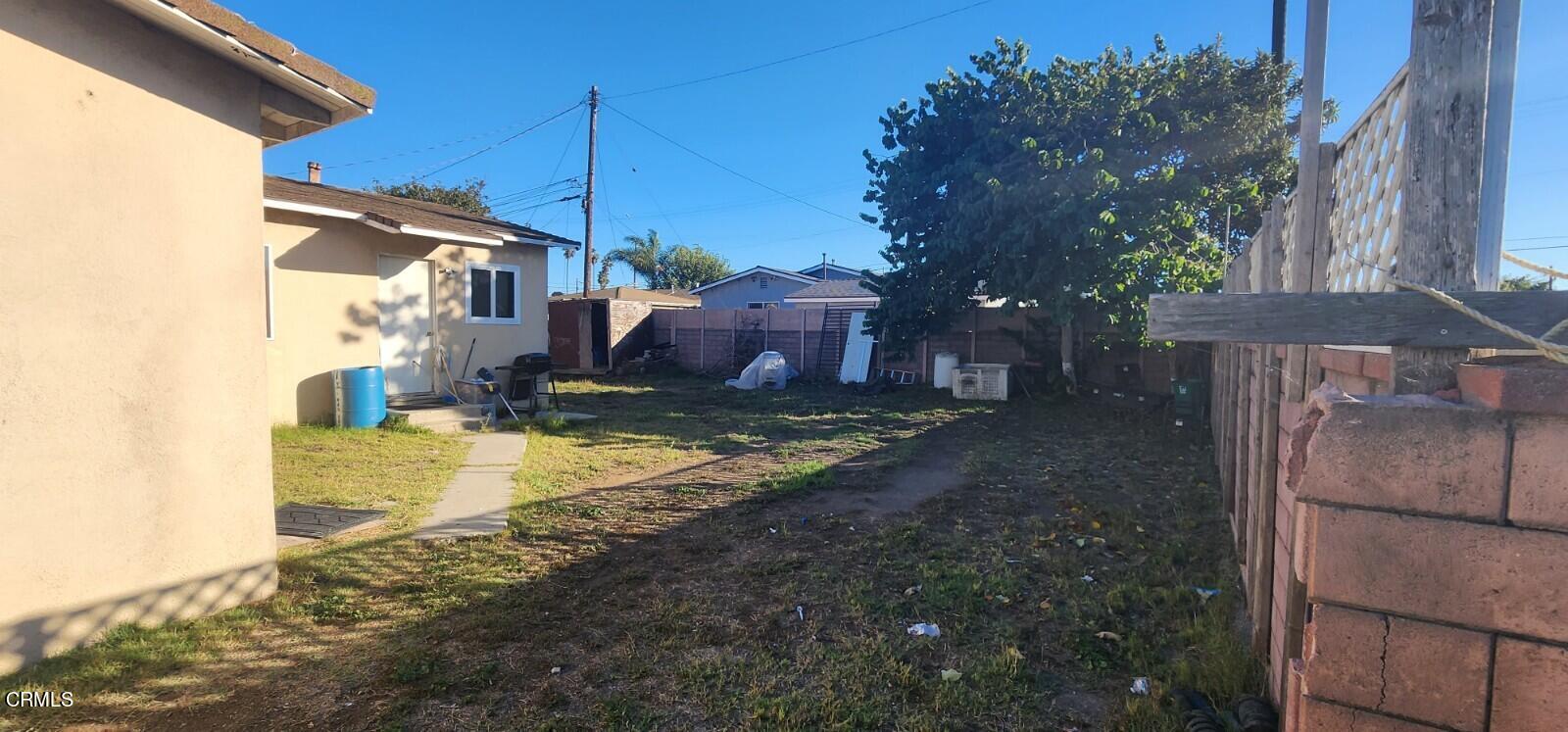 214 Smith Street Oxnard, CA 93033 - Photo 8 of 8 a view of a house with a yard