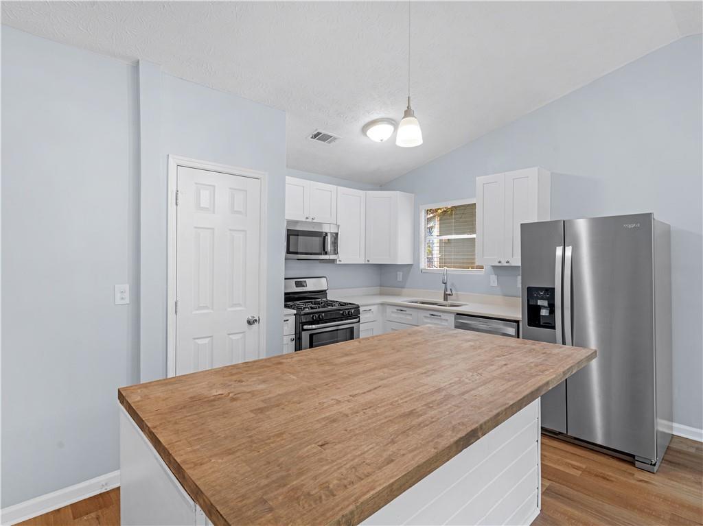 1540 Foxhall Lane Atlanta, GA 30316 - Photo 17 of 25 a kitchen with stainless steel appliances granite countertop a refrigerator a stove and a sink