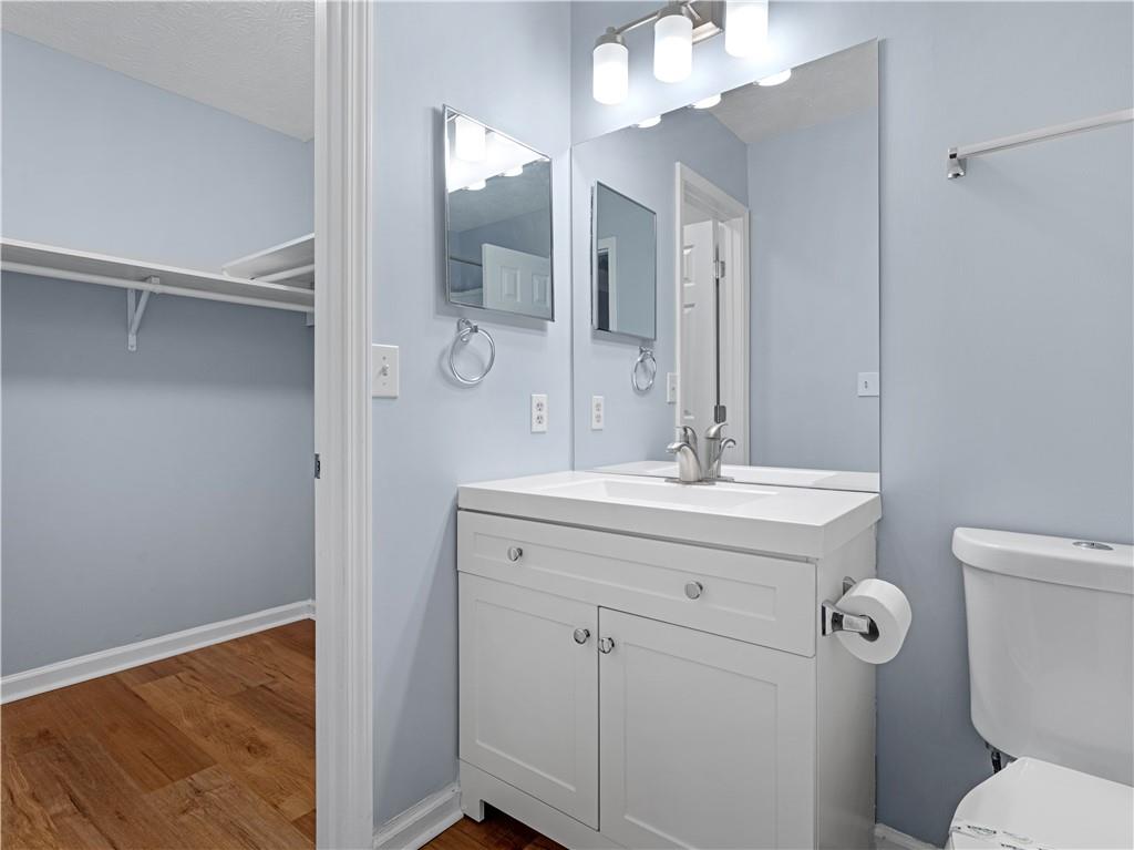 1540 Foxhall Lane Atlanta, GA 30316 - Photo 22 of 25 a bathroom with a sink a toilet and a mirror