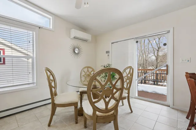 a view of a dining room with furniture window and outside view