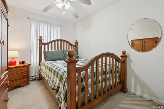 a bedroom with furniture and a window