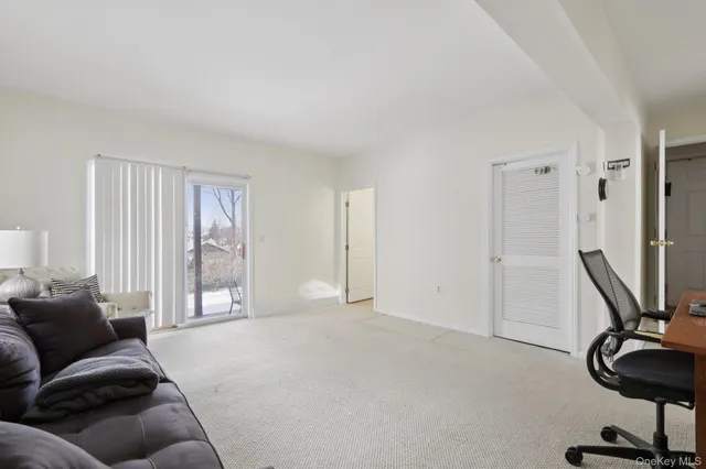a view of a livingroom with furniture and windows