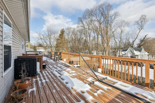 a view of a balcony with wooden floor