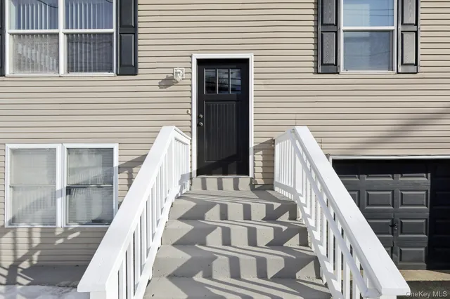 a view of balcony with wooden floor and fence