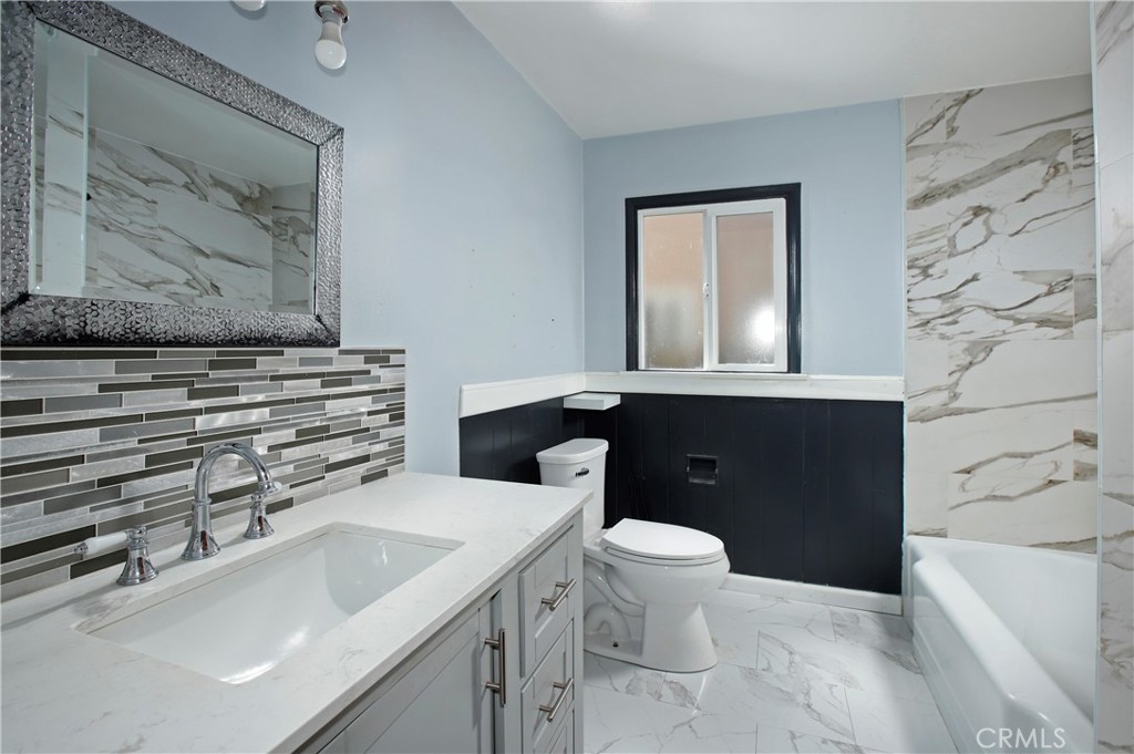 7339 Baird Avenue Reseda, CA 91335 - Photo 12 of 22 a bathroom with a sink and a toilet