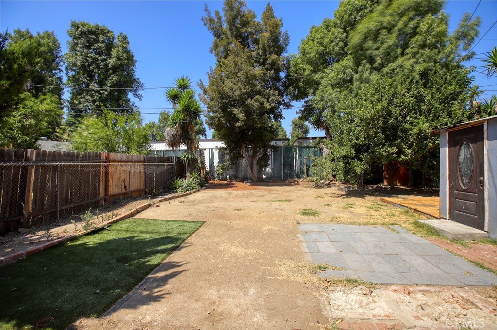 7339 Baird Avenue Reseda, CA 91335 - Photo 21 of 22 a view of a yard with plants and a tree