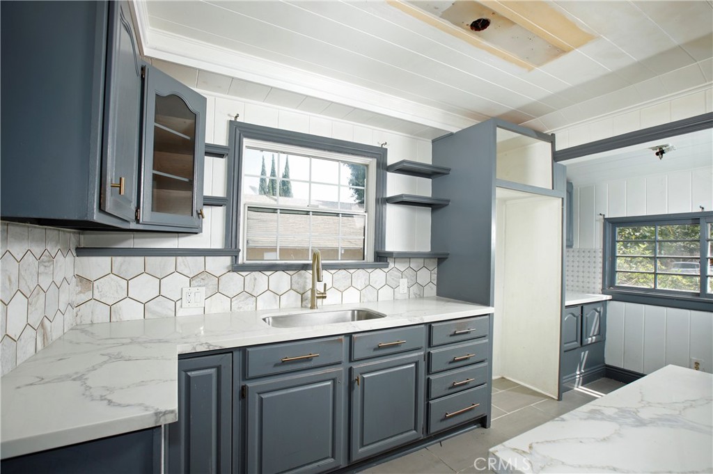 7339 Baird Avenue Reseda, CA 91335 - Photo 8 of 22 a bathroom with a double vanity sink mirror and