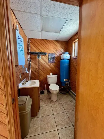 a bathroom with a toilet and a sink