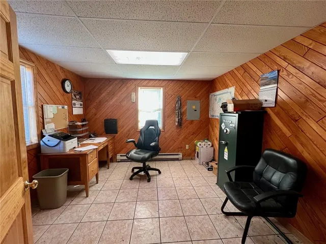 a room with lots of chairs and mirrors