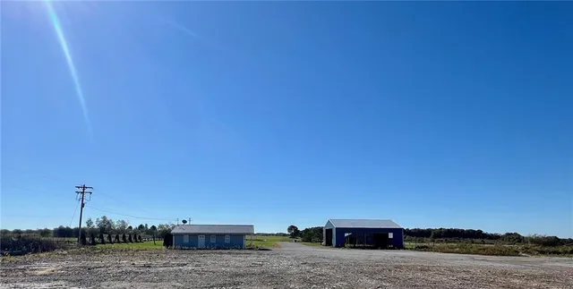 a view of terrace with lawn chairs