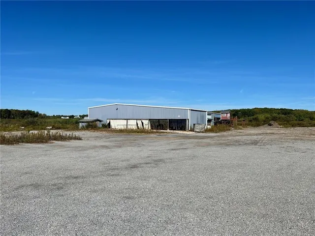 a view of a large building with sunset view