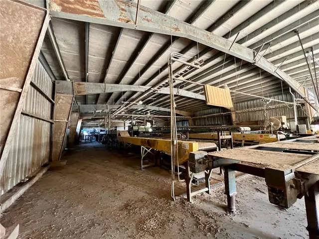 a view of a chairs and table in the balcony