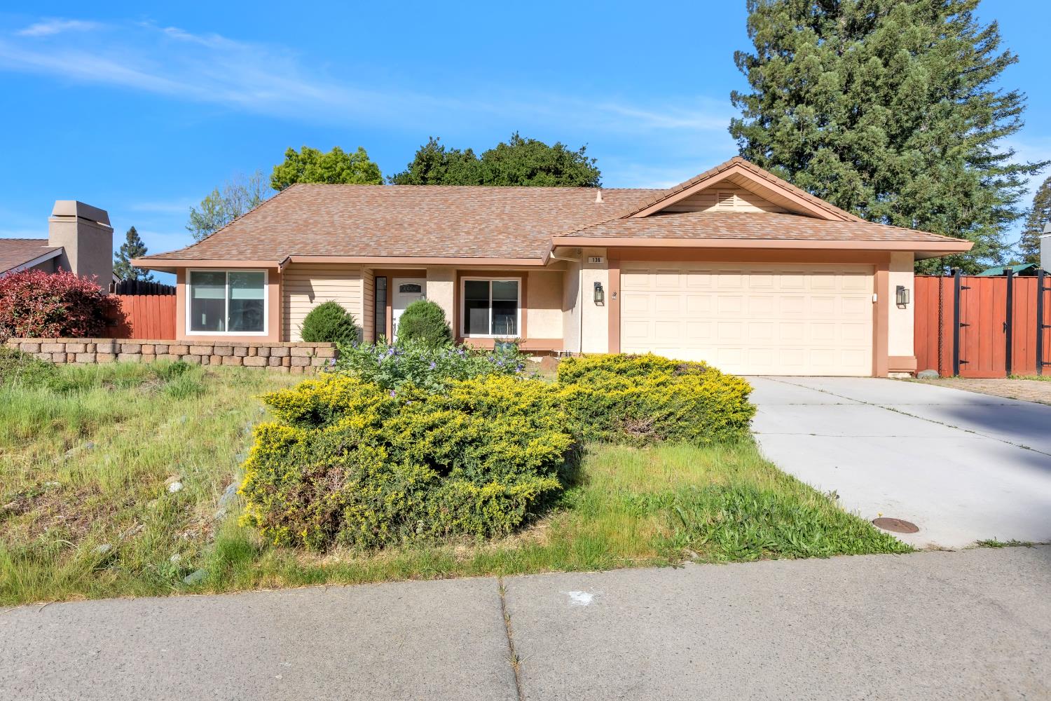 front view of a house with a yard