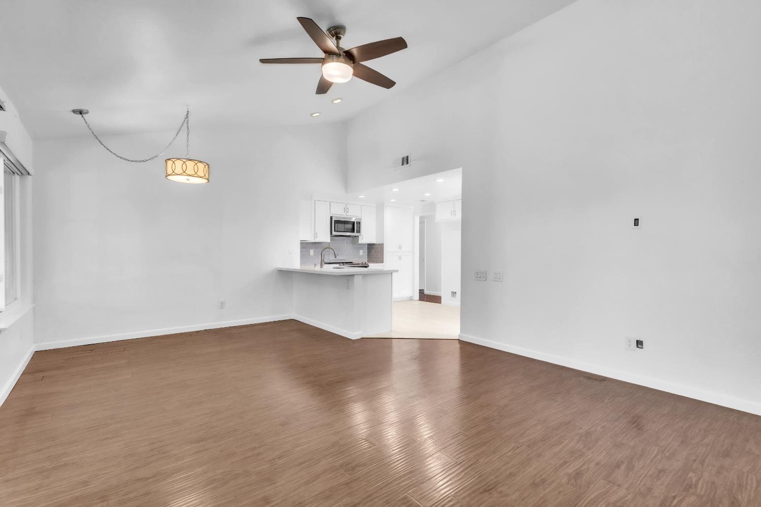 136 Rambling Drive Folsom, CA 95630 - Photo 15 of 31 a view of empty room with wooden floor and ceiling fan