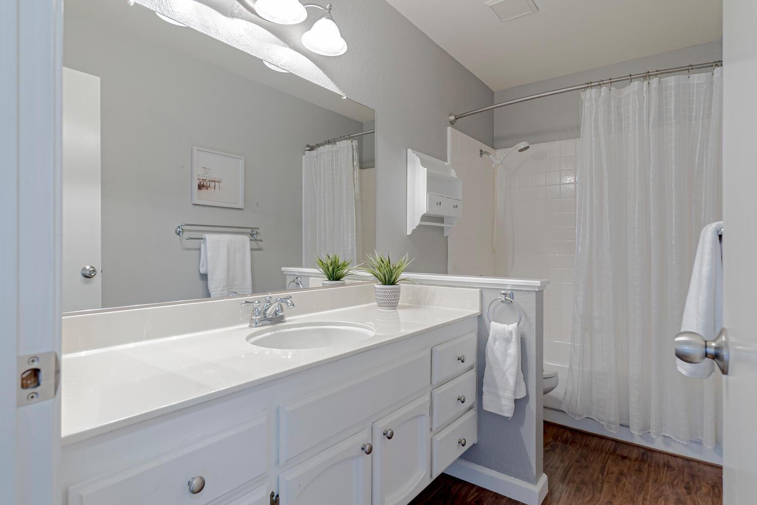 136 Rambling Drive Folsom, CA 95630 - Photo 16 of 31 a bathroom with a sink and a mirror