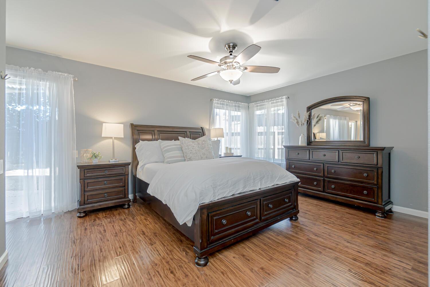 136 Rambling Drive Folsom, CA 95630 - Photo 18 of 31 a bedroom with a bed and wooden floor