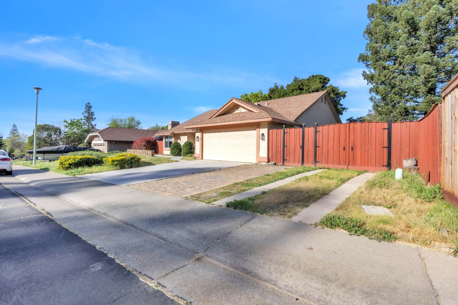 136 Rambling Drive Folsom, CA 95630 - Photo 2 of 31 a view of a house with a yard and sitting area