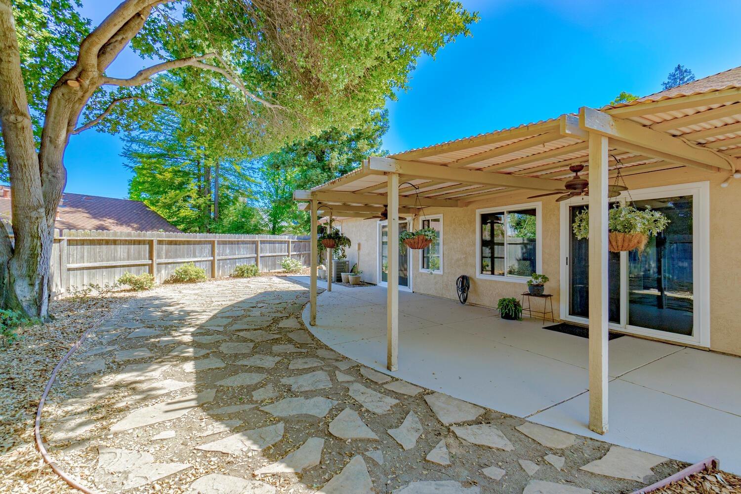 136 Rambling Drive Folsom, CA 95630 - Photo 30 of 31 a view of a house with backyard porch and sitting area