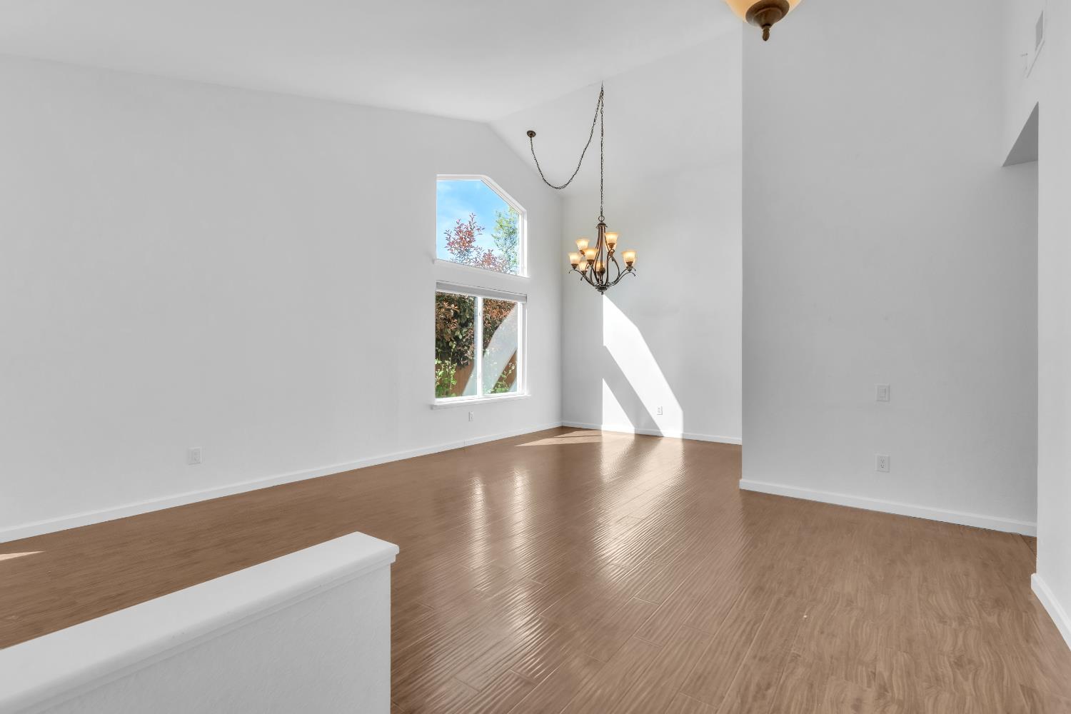 136 Rambling Drive Folsom, CA 95630 - Photo 3 of 31 wooden floor in an empty room with a window