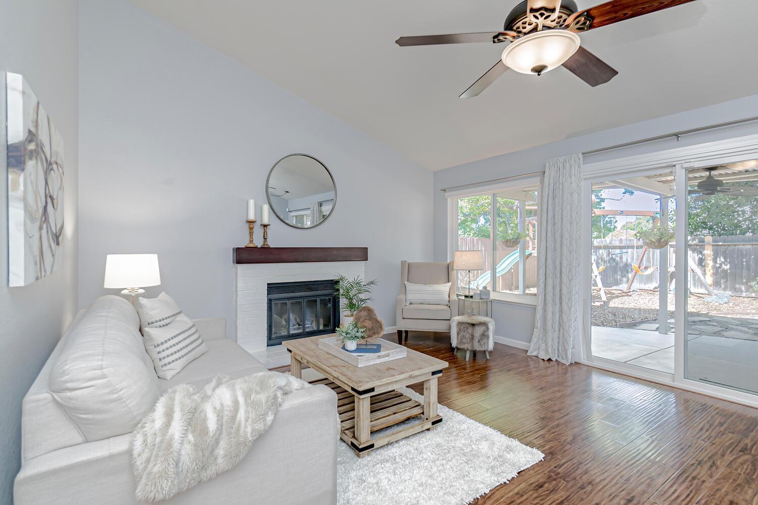 136 Rambling Drive Folsom, CA 95630 - Photo 6 of 31 a living room with furniture fireplace and window