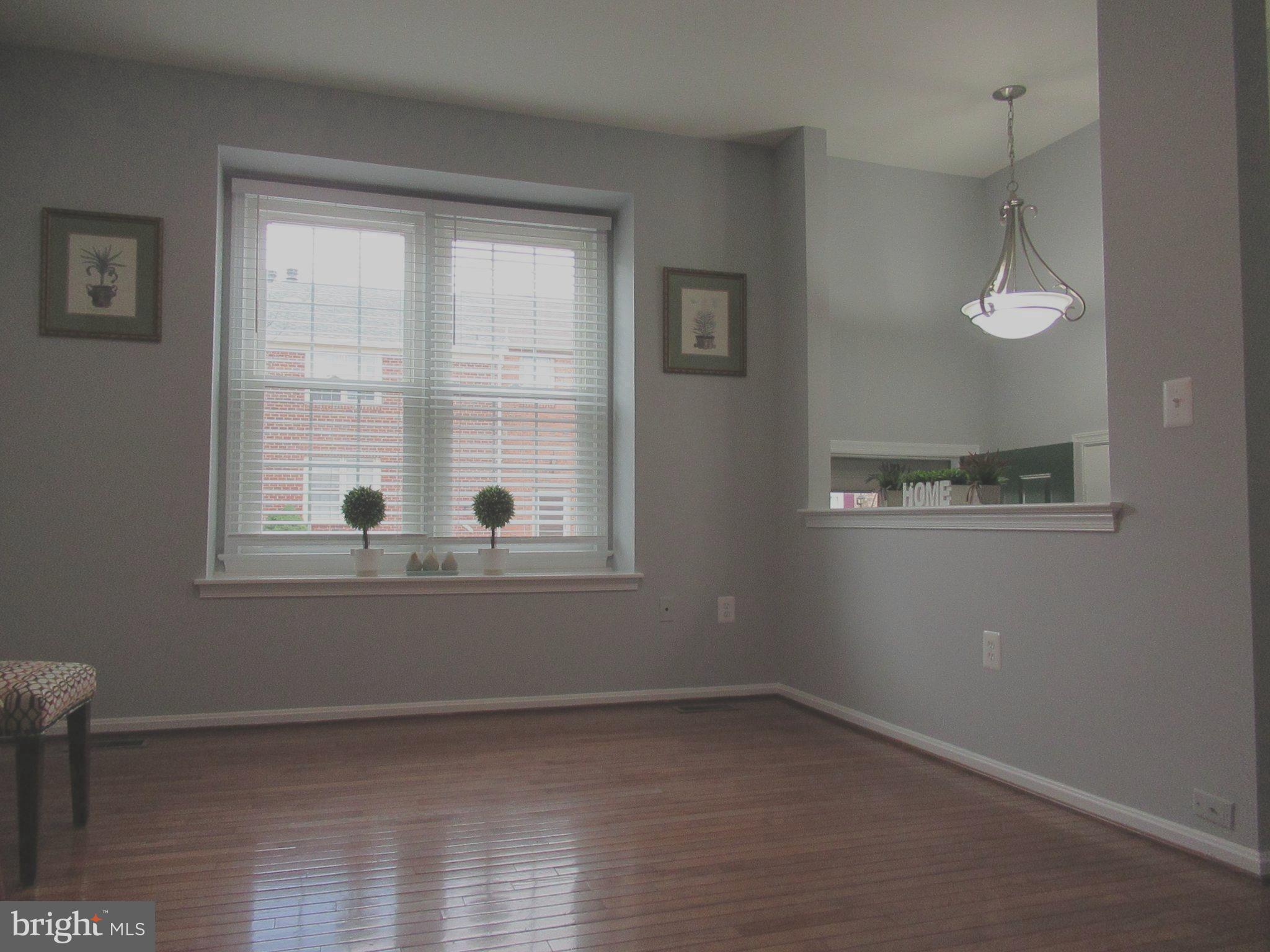 2310 Patternbond Drive Silver Spring, MD 20902 - Photo 2 of 29 a view of empty room with wooden floor and fan