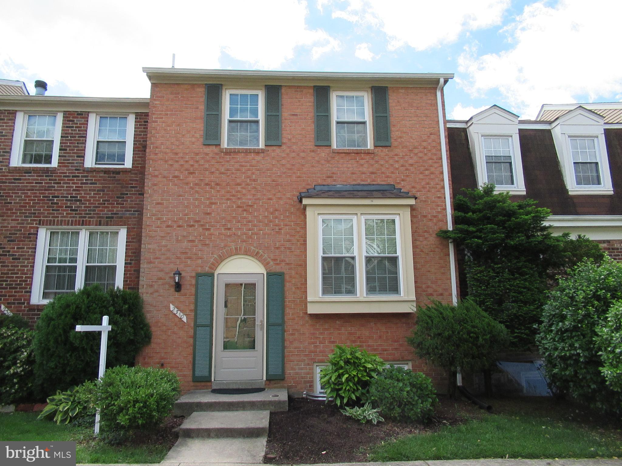2310 Patternbond Drive Silver Spring, MD 20902 - Photo 25 of 29 a front view of a house with a garden