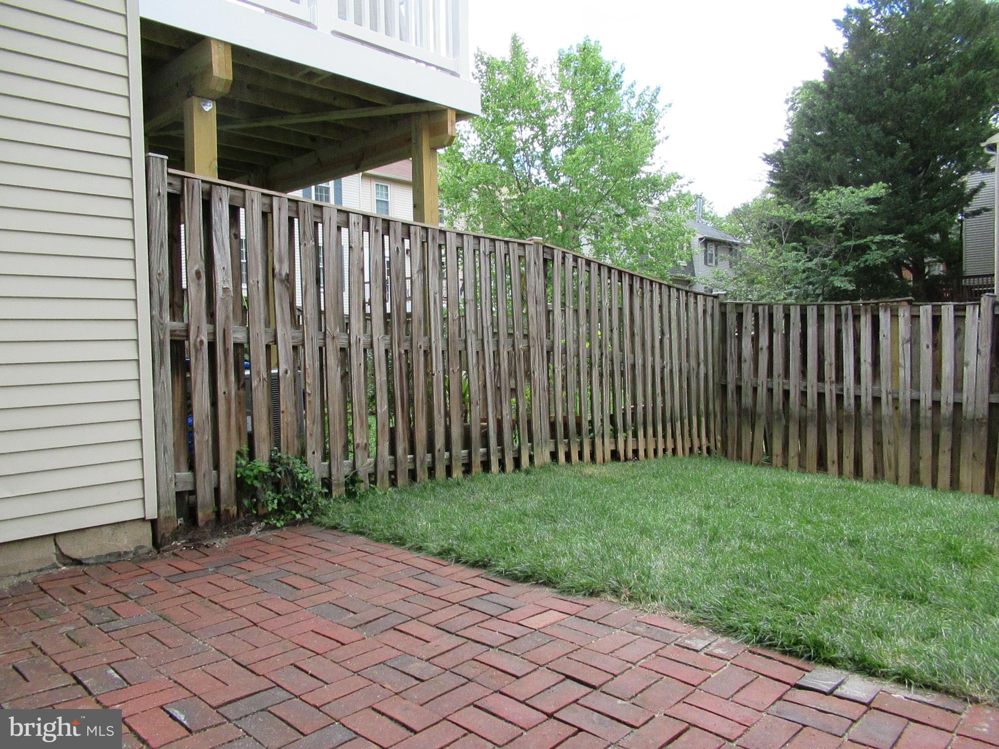 2310 Patternbond Drive Silver Spring, MD 20902 - Photo 26 of 29 a backyard of a house with plants and trees
