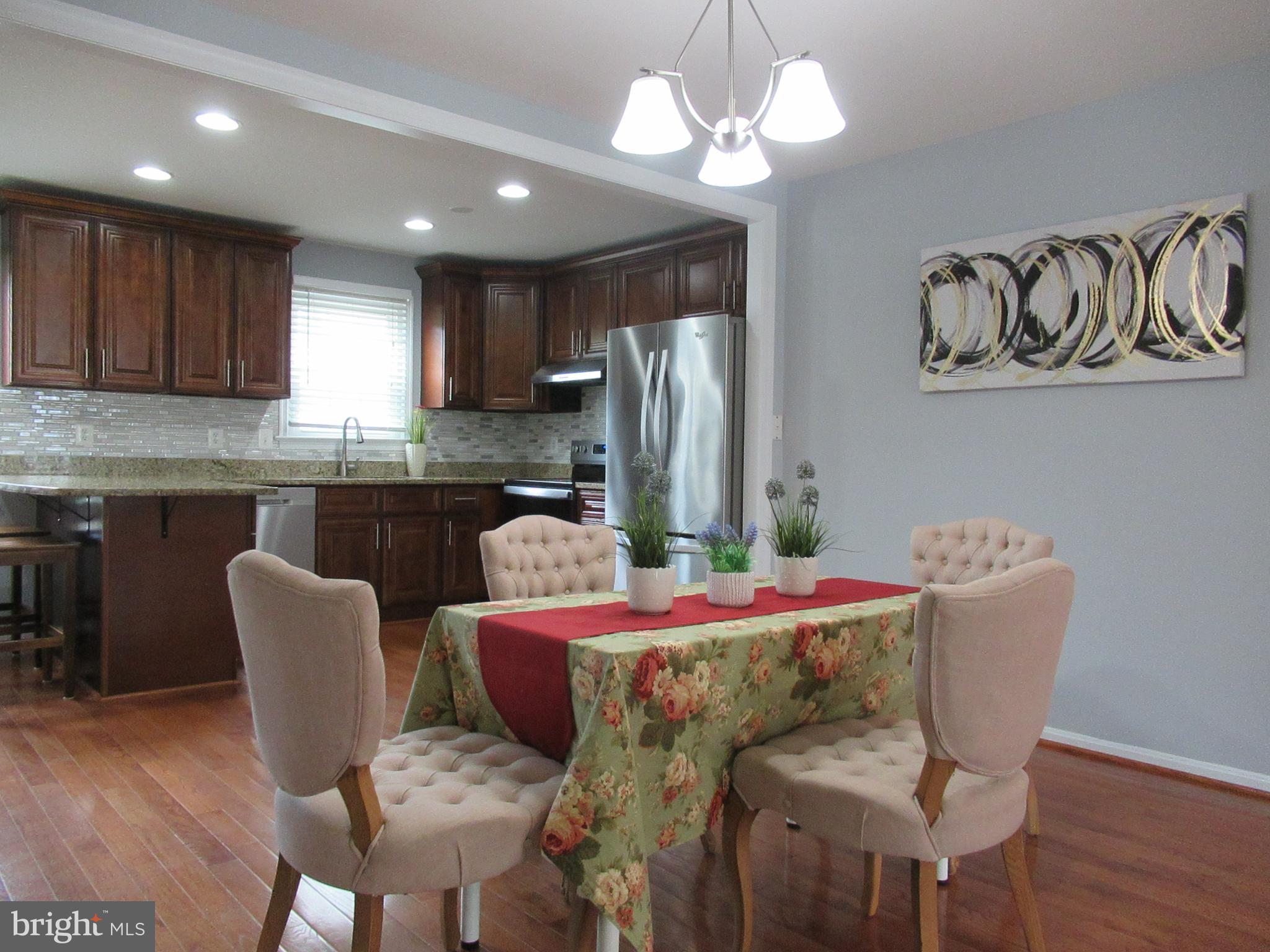 2310 Patternbond Drive Silver Spring, MD 20902 - Photo 4 of 29 a dining room with furniture and chandelier