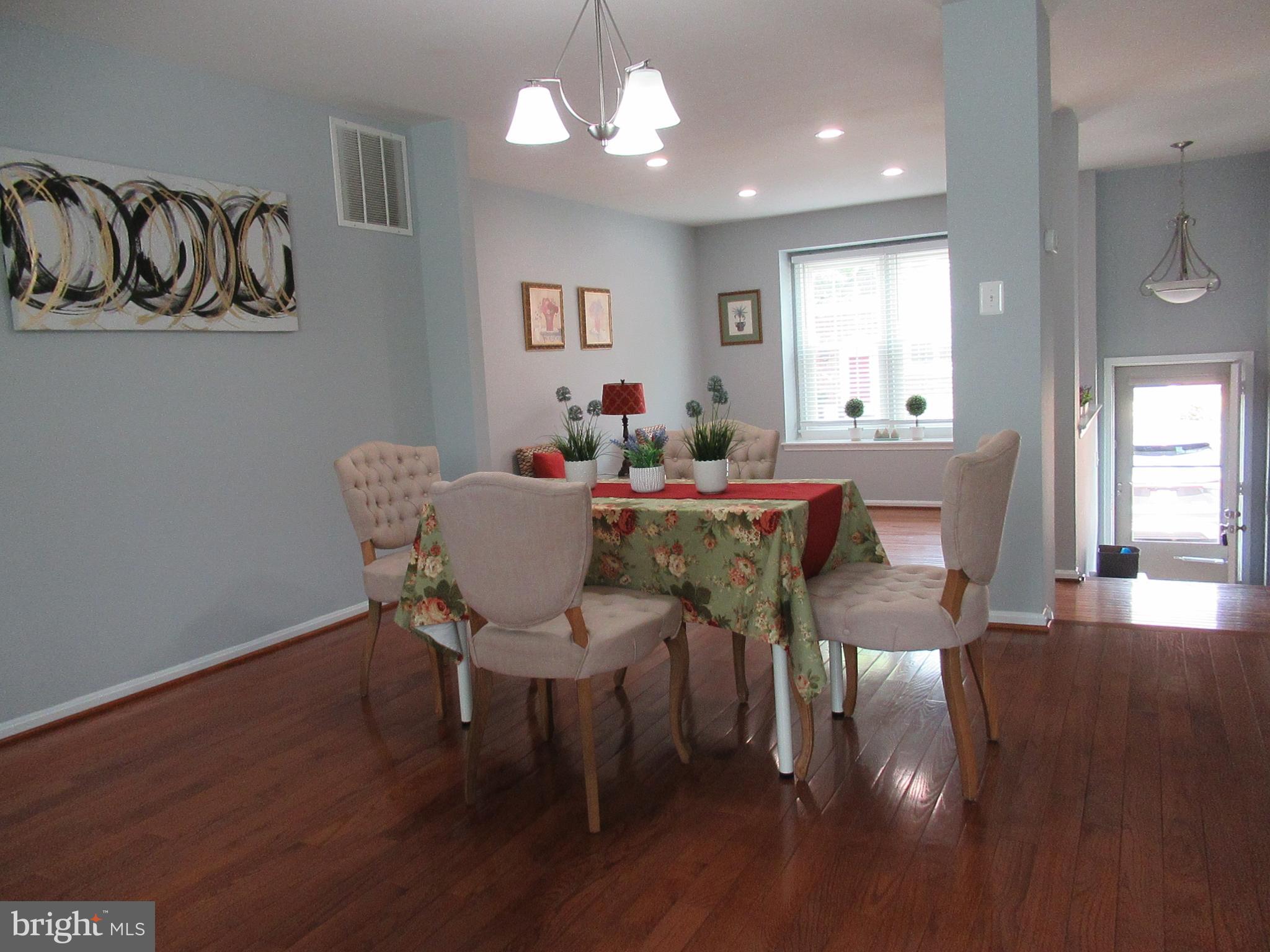 2310 Patternbond Drive Silver Spring, MD 20902 - Photo 5 of 29 a dining room with furniture and wooden floor