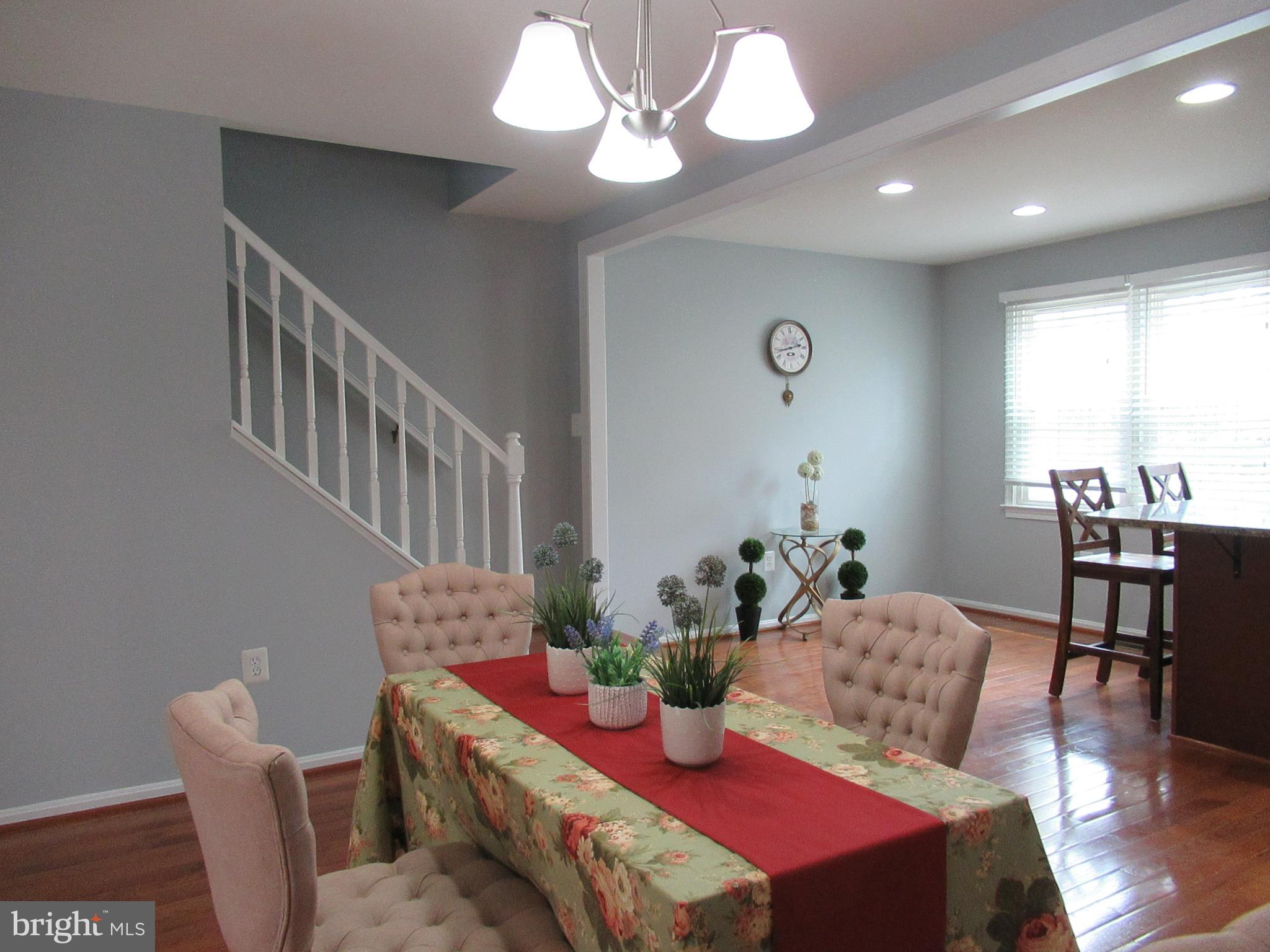 2310 Patternbond Drive Silver Spring, MD 20902 - Photo 6 of 29 a view of a dining room with furniture window and wooden floor