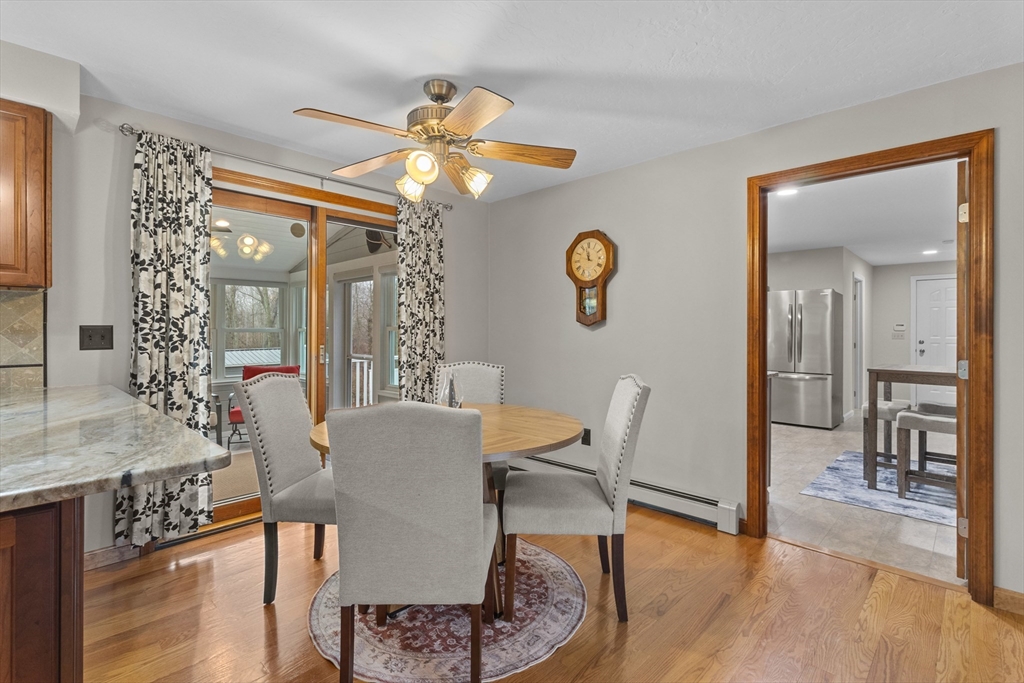 16 Flint Pond Road Worcester, MA 01604 - Photo 15 of 42 a view of a dining room with furniture and wooden floor