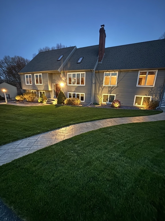 16 Flint Pond Road Worcester, MA 01604 - Photo 2 of 42 a front view of a house with a yard