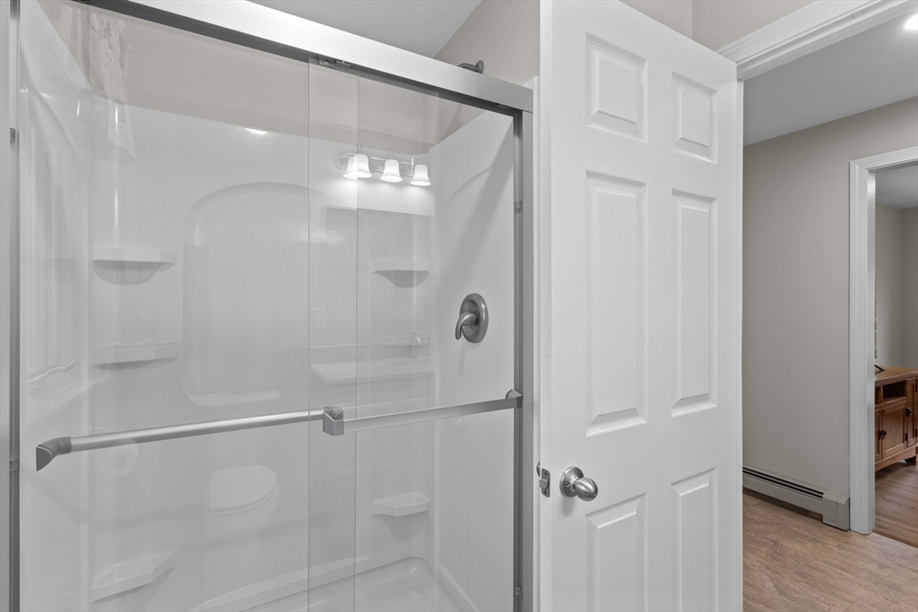 16 Flint Pond Road Worcester, MA 01604 - Photo 24 of 42 a bathroom with a glass shower door
