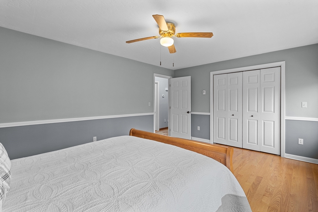 16 Flint Pond Road Worcester, MA 01604 - Photo 26 of 42 a bed room with a bed and a ceiling fan