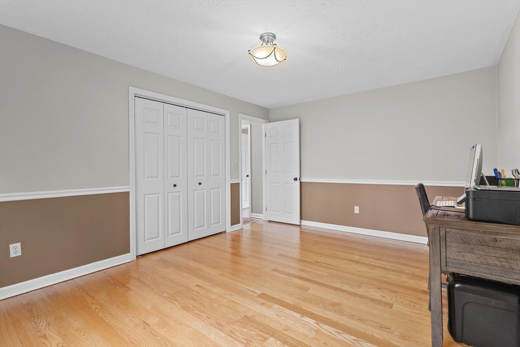 16 Flint Pond Road Worcester, MA 01604 - Photo 27 of 42 a view of kitchen and empty room with wooden floor