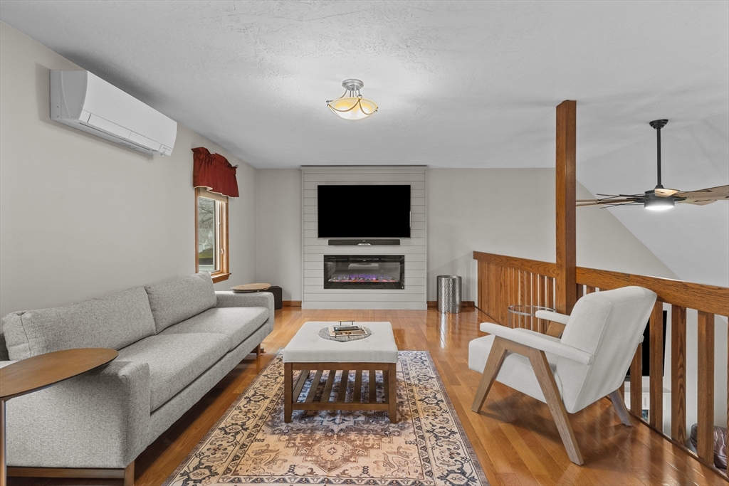 16 Flint Pond Road Worcester, MA 01604 - Photo 30 of 42 a living room with furniture and a flat screen tv