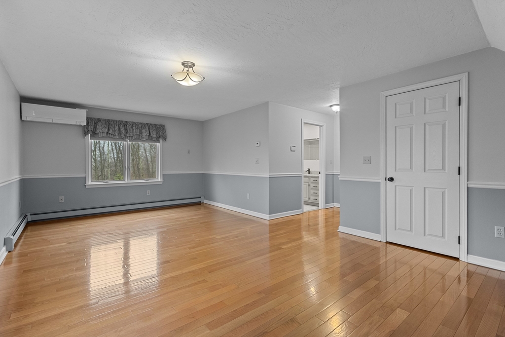 16 Flint Pond Road Worcester, MA 01604 - Photo 31 of 42 a view of empty room with wooden floor and fan