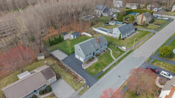 an aerial view of houses with yard