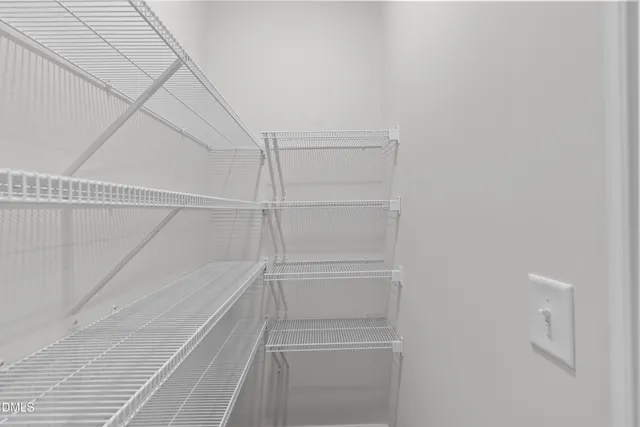 a view of an empty walk in closet