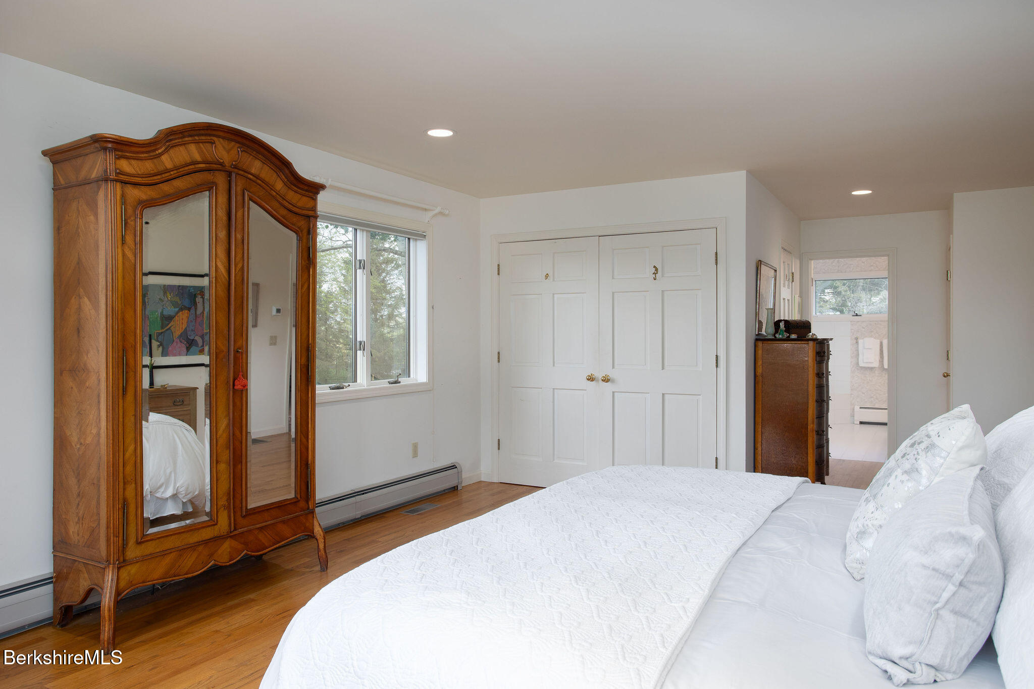77 Hurlburt Road Great Barrington, MA 01230 - Photo 27 of 48 a bedroom with a bed and a mirror