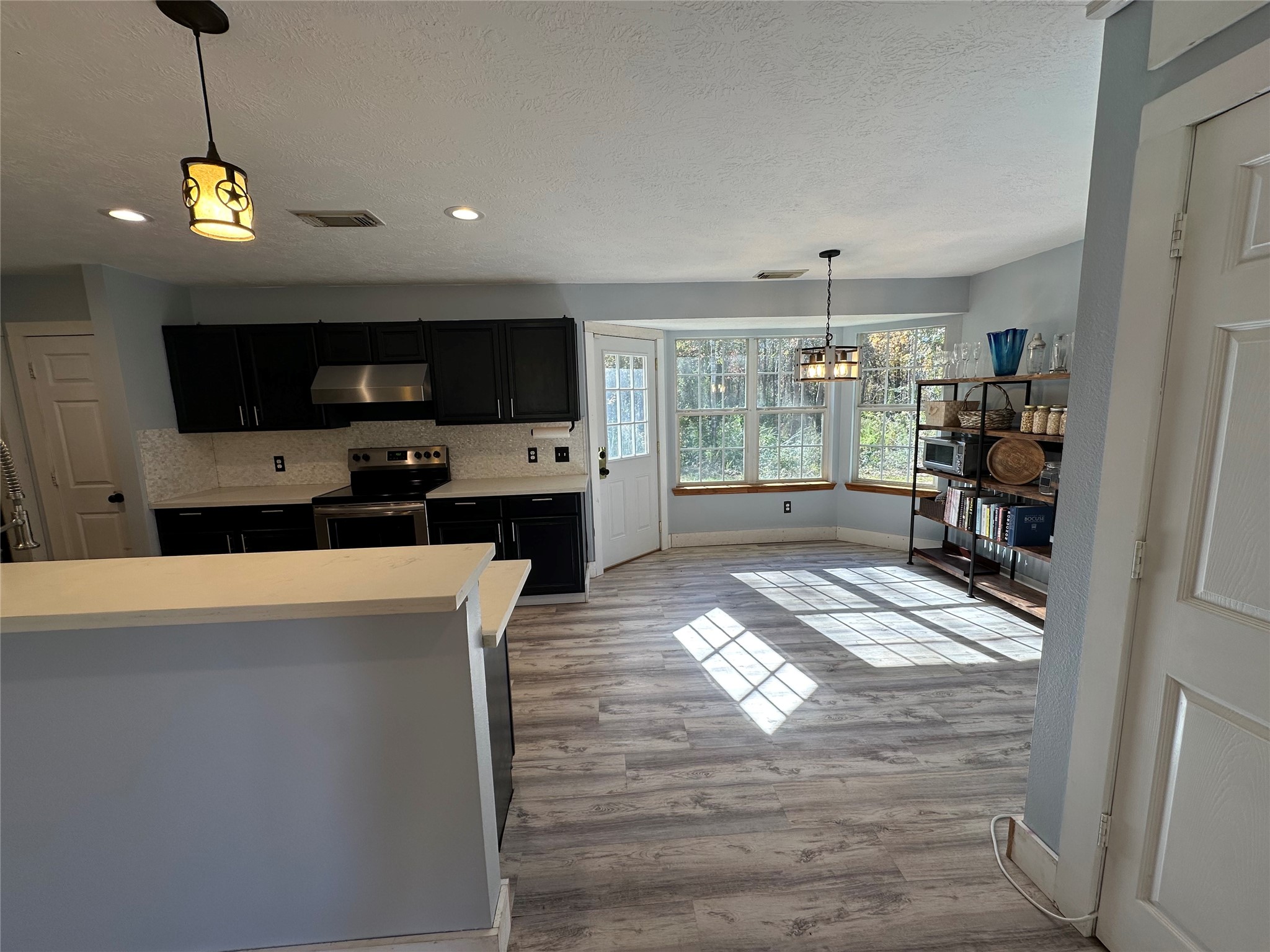 1001 Oak Ridge Road Willis, TX 77378 - Photo 7 of 14 a view of a living room a window and a flat screen tv