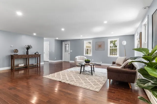 a living room with furniture and a table