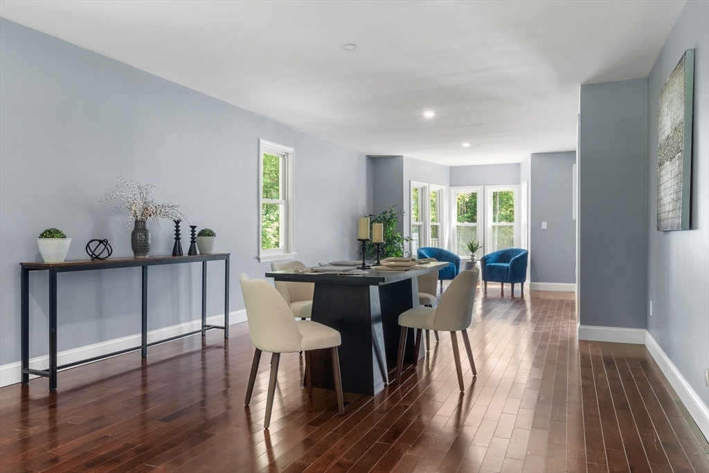23 East Windsor Road Worthington, MA 01098 - Photo 12 of 40 a view of a dining room with furniture and wooden floor