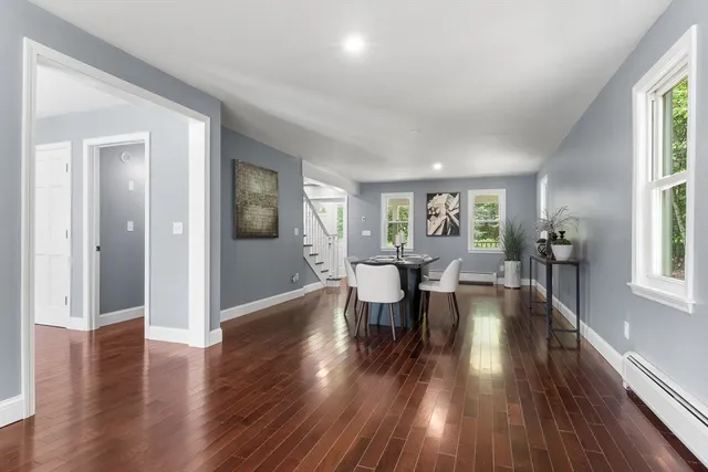 a view of a livingroom with furniture window and wooden floor
