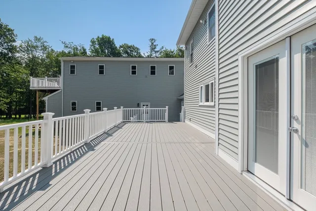 a terrace view with wooden floor and fence