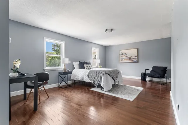 a bedroom with a bed and a table